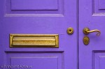 Old Gold and Royal Purple Image of a door handle and a mail slot.