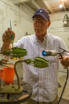 Stewart Wegner putting the finishing touches on a bronze sculpture.